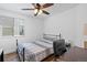 Well-lit bedroom featuring a comfortable bed, desk, and a window with blinds for adjustable lighting at 271 Terra Vista St, Brighton, CO 80601