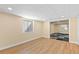 Bright bedroom with laminated flooring, large windows, and neutral paint at 271 Terra Vista St, Brighton, CO 80601