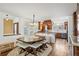 Dining area with large table and chairs, seamlessly connected to the kitchen at 271 Terra Vista St, Brighton, CO 80601