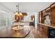 Dining area featuring custom wood cabinets and adjacent to the kitchen area at 271 Terra Vista St, Brighton, CO 80601