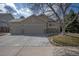 Charming home featuring a three-car garage and stone accents on the exterior at 271 Terra Vista St, Brighton, CO 80601