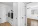 Bright laundry room featuring a modern washer and dryer set, ample storage space, and convenient access to the bedroom at 271 Terra Vista St, Brighton, CO 80601