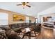 Inviting living room with open layout, comfortable seating and hardwood floors at 271 Terra Vista St, Brighton, CO 80601