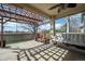 Covered patio with stamped concrete, ceiling fan, and outdoor seating and pergola at 271 Terra Vista St, Brighton, CO 80601