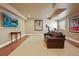 Finished basement featuring a large-screen TV, comfortable seating, and exercise equipment at 520 Jackson St, Denver, CO 80206