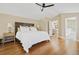 Spacious bedroom featuring a ceiling fan, wood floors, and a relaxing ambiance at 520 Jackson St, Denver, CO 80206