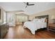 Serene bedroom with natural light, a ceiling fan, and access to a private outdoor space at 520 Jackson St, Denver, CO 80206
