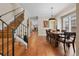 Open-concept living space showcasing staircase, and dining area with modern furnishings at 520 Jackson St, Denver, CO 80206