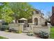 Charming home featuring a gated courtyard with lush landscaping and inviting outdoor living space at 520 Jackson St, Denver, CO 80206