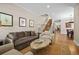 Cozy living room featuring comfortable seating, hardwood floors, and plenty of natural light at 520 Jackson St, Denver, CO 80206
