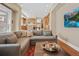 Open-concept living room with comfortable seating and modern decor connected to the kitchen at 520 Jackson St, Denver, CO 80206