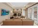 Cozy living room featuring a fireplace, a comfortable sectional sofa, and contemporary decor at 520 Jackson St, Denver, CO 80206