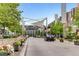 Charming street view of the property with brick paved road, flower planters, and pedestrian walkway at 520 Jackson St, Denver, CO 80206