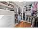Well-organized walk-in closet featuring custom shelving and ample storage space at 520 Jackson St, Denver, CO 80206