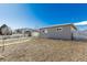 Backyard view of detached garage with ample space at 5511 Leyden St, Commerce City, CO 80022