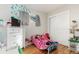 bedroom with Minnie Mouse bedding and built in closet at 5511 Leyden St, Commerce City, CO 80022