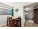 Small dining area with a wooden table and four chairs at 5511 Leyden St, Commerce City, CO 80022