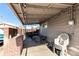 Covered patio with brick grill and outdoor seating at 5511 Leyden St, Commerce City, CO 80022