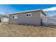 Side of house with small yard and shed at 5511 Leyden St, Commerce City, CO 80022