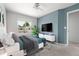 Comfortable bedroom with modern furniture, bright light from a large window, and contemporary decor at 1359 S Beeler Ct, Denver, CO 80247