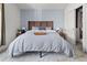 Comfortable bedroom with a blue accent wall, wooden headboard, side tables, and a patterned rug at 1359 S Beeler Ct, Denver, CO 80247