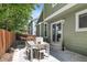Charming patio with dining set, perfect for outdoor entertaining and relaxation at 1359 S Beeler Ct, Denver, CO 80247