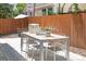 Inviting patio with dining set, perfect for outdoor entertaining in a private backyard at 1359 S Beeler Ct, Denver, CO 80247
