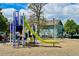 A vibrant playground featuring a green slide and rope climbing structure for active play at 1359 S Beeler Ct, Denver, CO 80247