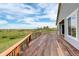 Take in the beautiful view from this well-maintained back deck featuring wooden rails and plenty of space to relax at 2504 Elkhorn Ranch St, Parker, CO 80138