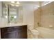 Well-lit bathroom features shower over tub, vanity with storage, and tiled flooring at 2504 Elkhorn Ranch St, Parker, CO 80138