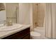 Bright bathroom with granite vanity, white toilet and tiled bath tub at 2504 Elkhorn Ranch St, Parker, CO 80138