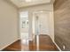 Elegant foyer with hardwood floors and modern wood accent wall at 2504 Elkhorn Ranch St, Parker, CO 80138