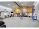 Inside the large garage you can see a two-post lift and lots of space to work on your favorite hobby at 2504 Elkhorn Ranch St, Parker, CO 80138