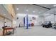 The inside of the garage has lots of space with an additional car lift and additional spots to tinker on your car at 2504 Elkhorn Ranch St, Parker, CO 80138