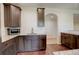 Cozy kitchen featuring granite counters, stainless steel appliances, and wooden cabinetry at 2504 Elkhorn Ranch St, Parker, CO 80138