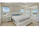 Bright main bedroom with large windows offering amazing views, a tray ceiling and lots of space at 2504 Elkhorn Ranch St, Parker, CO 80138
