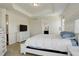 Bright main bedroom with tray ceilings, carpet floors, dresser and ensuite access at 2504 Elkhorn Ranch St, Parker, CO 80138