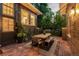 Charming backyard patio with a dining table and brick paving, creating an inviting outdoor space at 1500 E 7Th Ave, Denver, CO 80218