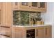 Custom wet bar area featuring marble countertops, wine storage, and stylish fixtures at 1500 E 7Th Ave, Denver, CO 80218