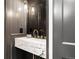 Modern bathroom features a marble sink, stylish fixtures, and gray walls at 1500 E 7Th Ave, Denver, CO 80218