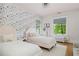 Bedroom featuring two beds and a wall decorated with floral wallpaper at 1500 E 7Th Ave, Denver, CO 80218