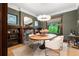 Stylish dining room with a oval table, modern chairs, and elegant chandelier at 1500 E 7Th Ave, Denver, CO 80218