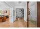 Elegant foyer with herringbone wood floors, staircase, and open access to living areas at 1500 E 7Th Ave, Denver, CO 80218