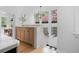 Bright hallway with cabinets, marble countertops, and stylish chandelier at 1500 E 7Th Ave, Denver, CO 80218