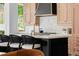 Close up of kitchen island with white countertops, designer hardware, and custom cabinets at 1500 E 7Th Ave, Denver, CO 80218