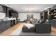 Inviting living room with a fireplace, flat screen TV and an oversized gray sectional sofa at 1500 E 7Th Ave, Denver, CO 80218