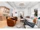 Spacious living room with stylish furniture, coffered ceilings, and an open layout to the kitchen at 1500 E 7Th Ave, Denver, CO 80218