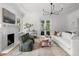 Bright living room with fireplace, large windows, and classic decor at 1500 E 7Th Ave, Denver, CO 80218