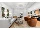 Bright living room features coffered ceilings, hardwood floors, and modern furnishings at 1500 E 7Th Ave, Denver, CO 80218