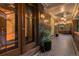 Inviting covered porch with patterned tile flooring, decorative lighting, and outdoor seating area at 1500 E 7Th Ave, Denver, CO 80218